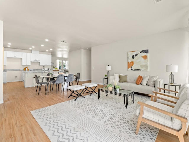2303 S Bush Ave, Fresno, CA 93727 - living area featuring recessed lighting and light wood-style flooring