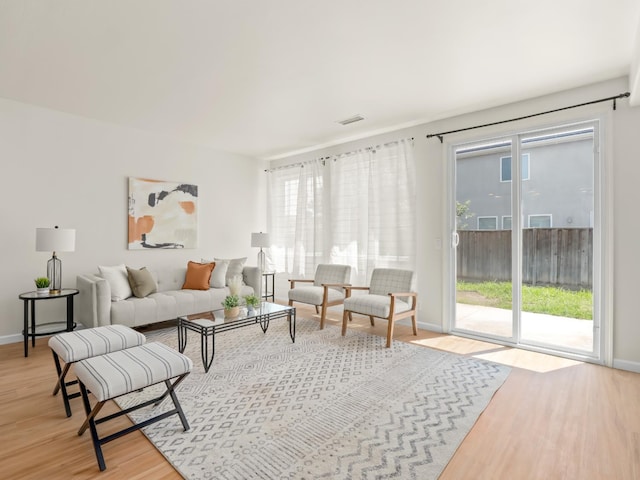 2303 S Bush Ave, Fresno, CA 93727 - living area featuring light wood-style floors and plenty of natural light