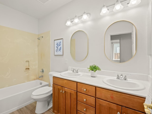 2303 S Bush Ave, Fresno, CA 93727 - bathroom with double vanity,  shower combination, and wood finished floors