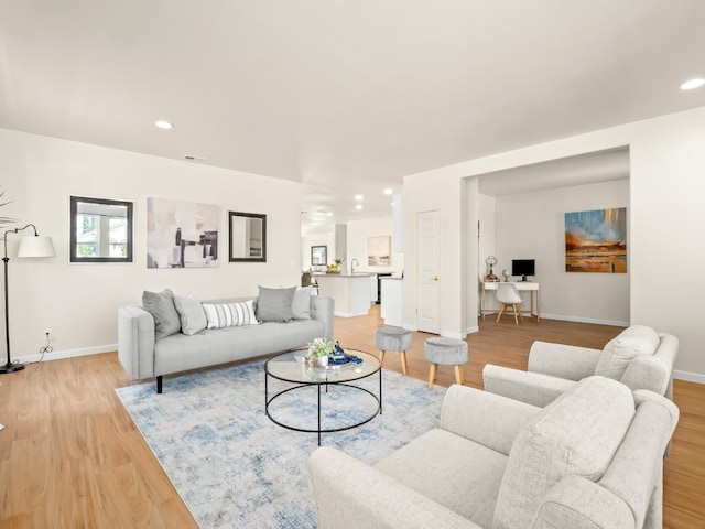 2303 S Bush Ave, Fresno, CA 93727 - living area with light wood finished floors and recessed lighting