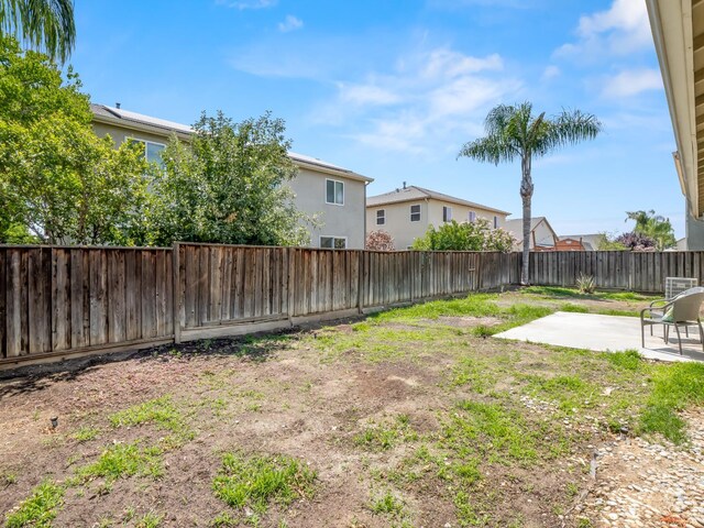 2303 S Bush Ave, Fresno, CA 93727 - fenced backyard with a patio area