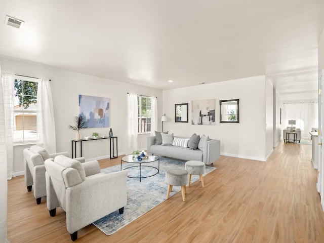 2303 S Bush Ave, Fresno, CA 93727 - living area with light wood-style flooring and recessed lighting