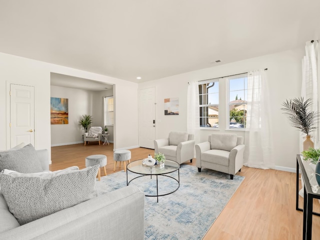 2303 S Bush Ave, Fresno, CA 93727 - living area with light wood finished floors and baseboards