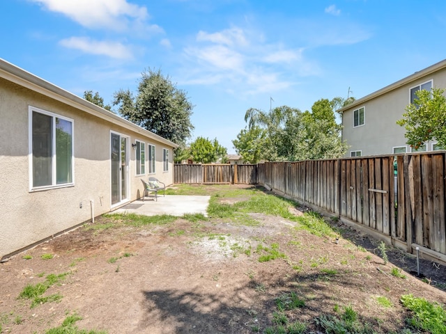 2303 S Bush Ave, Fresno, CA 93727 - fenced backyard with a patio