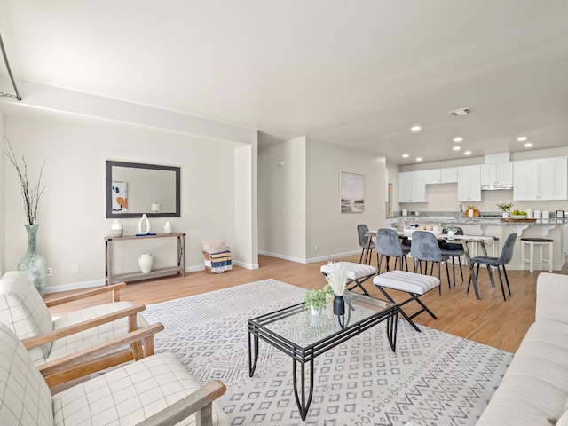 2303 S Bush Ave, Fresno, CA 93727 - living room featuring recessed lighting and light wood finished floors