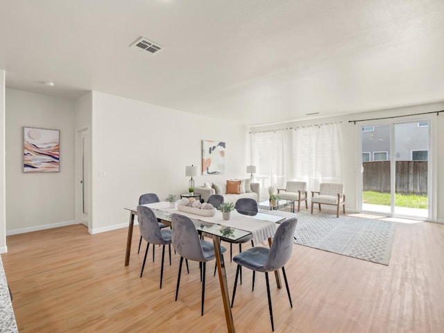 2303 S Bush Ave, Fresno, CA 93727 - dining area featuring light wood-style floors and baseboards