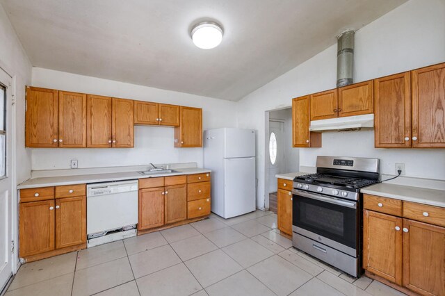 22 Beverly Dr, Clovis, CA 93612 - kitchen with white appliances, under cabinet range hood, lofted ceiling, light countertops, and brown cabinets