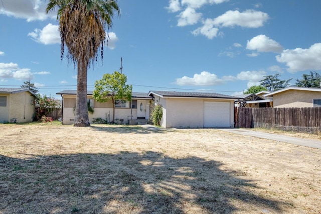 22 Beverly Dr, Clovis, CA 93612 - view of front of home featuring stucco siding, driveway, and an attached garage