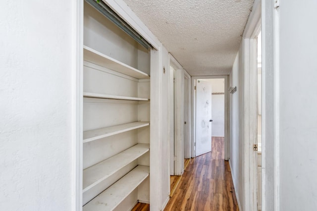 22 Beverly Dr, Clovis, CA 93612 - corridor with a textured ceiling and wood finished floors