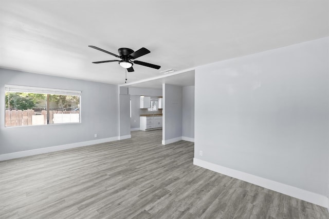 4014 E Olive Ave, Fresno, CA 93702 - unfurnished living room featuring light wood-style floors and ceiling fan