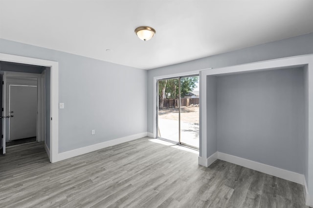 4014 E Olive Ave, Fresno, CA 93702 - empty room with wood finished floors and baseboards