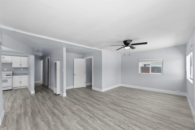 4014 E Olive Ave, Fresno, CA 93702 - unfurnished living room featuring light wood finished floors and ceiling fan