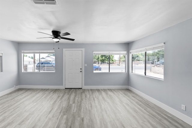 4014 E Olive Ave, Fresno, CA 93702 - unfurnished living room featuring wood finished floors and a ceiling fan