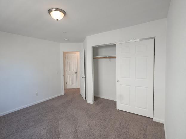 435 E San Pedro St, Merced, CA 95341 - unfurnished bedroom with carpet floors and a closet