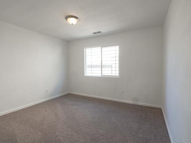 435 E San Pedro St, Merced, CA 95341 - spare room featuring carpet flooring