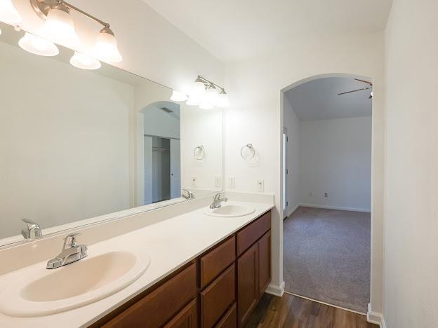 435 E San Pedro St, Merced, CA 95341 - full bath with double vanity and wood finished floors