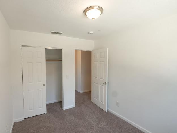 435 E San Pedro St, Merced, CA 95341 - unfurnished bedroom with carpet floors and a closet