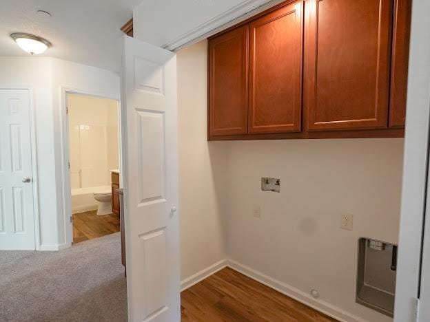 435 E San Pedro St, Merced, CA 95341 - washroom with cabinet space and wood finished floors