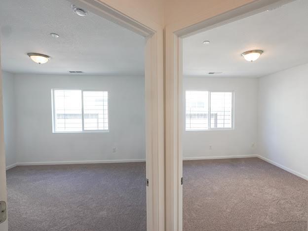 435 E San Pedro St, Merced, CA 95341 - spare room featuring carpet and baseboards