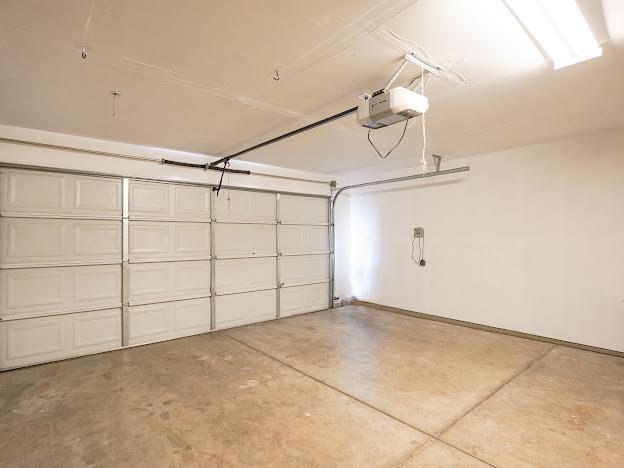 435 E San Pedro St, Merced, CA 95341 - garage featuring a garage door opener