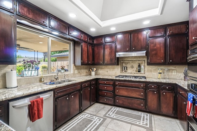 6658 N Thorne Ave, Fresno, CA 93711 - kitchen featuring appliances with stainless steel finishes, backsplash, under cabinet range hood, and recessed lighting