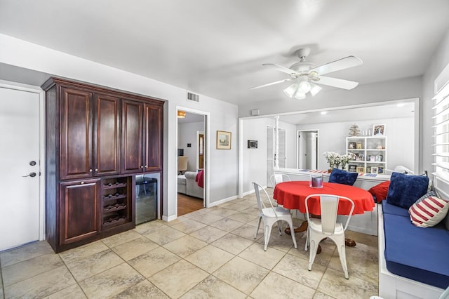 6658 N Thorne Ave, Fresno, CA 93711 - dining room with ceiling fan, light tile patterned flooring, and beverage cooler