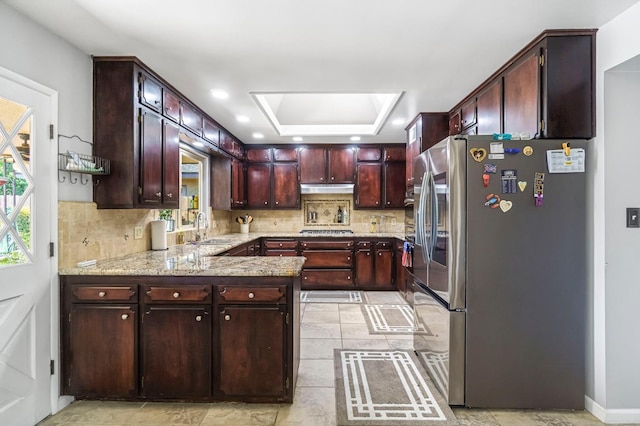 6658 N Thorne Ave, Fresno, CA 93711 - kitchen featuring appliances with stainless steel finishes, healthy amount of natural light, tasteful backsplash, a peninsula, and recessed lighting