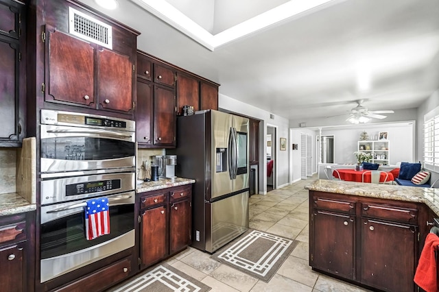 6658 N Thorne Ave, Fresno, CA 93711 - kitchen with appliances with stainless steel finishes, light countertops, light tile patterned floors, and a ceiling fan