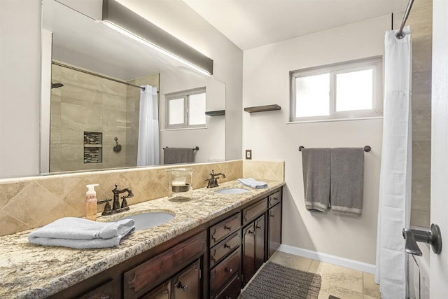 6658 N Thorne Ave, Fresno, CA 93711 - bathroom with double vanity, decorative backsplash, and tiled shower