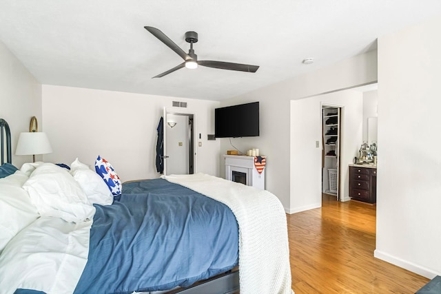 6658 N Thorne Ave, Fresno, CA 93711 - bedroom featuring light wood finished floors and ceiling fan