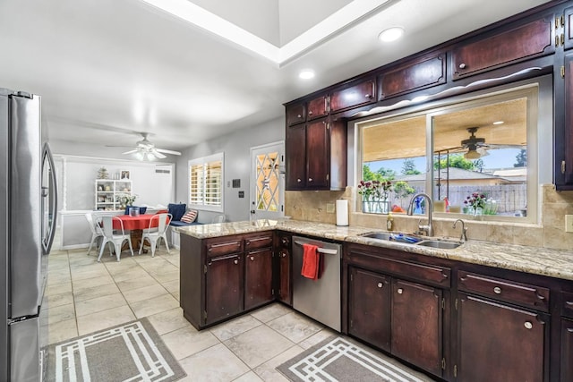6658 N Thorne Ave, Fresno, CA 93711 - kitchen featuring appliances with stainless steel finishes, ceiling fan, decorative backsplash, a peninsula, and recessed lighting