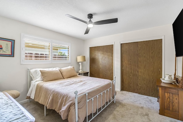 6658 N Thorne Ave, Fresno, CA 93711 - bedroom with carpet flooring, multiple closets, and a ceiling fan
