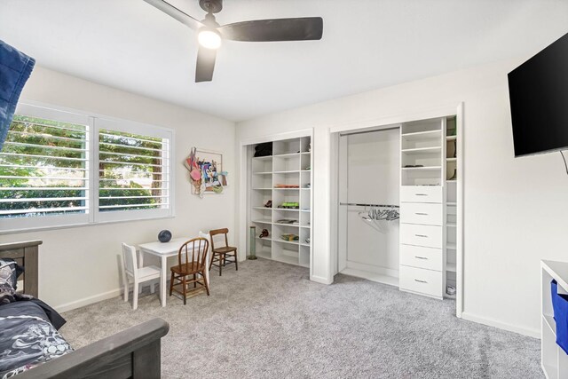 6658 N Thorne Ave, Fresno, CA 93711 - bedroom with carpet flooring, multiple closets, and ceiling fan