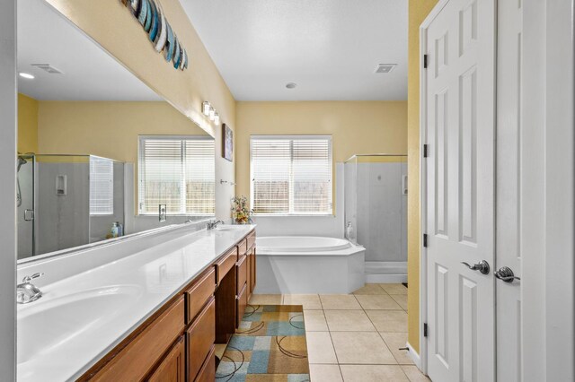 2403 W Robin Ave, Visalia, CA 93291 - full bathroom featuring a stall shower, a bath, double vanity, and tile patterned floors