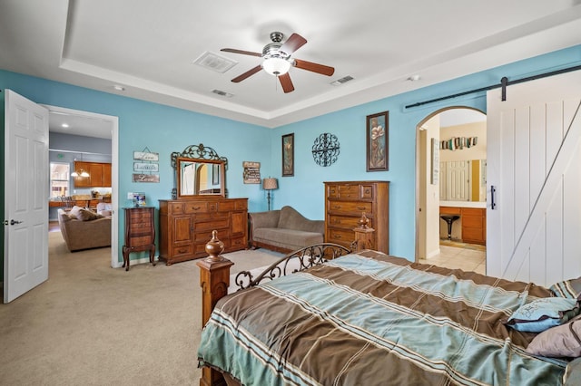 2403 W Robin Ave, Visalia, CA 93291 - bedroom with a raised ceiling, arched walkways, light colored carpet, and ceiling fan
