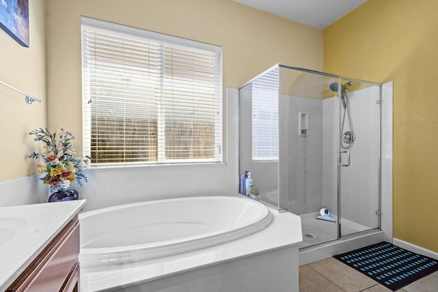 2403 W Robin Ave, Visalia, CA 93291 - full bathroom with a stall shower, a garden tub, tile patterned flooring, and vanity