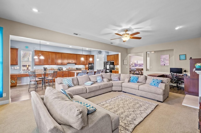 2403 W Robin Ave, Visalia, CA 93291 - living room featuring an office area, light carpet, a ceiling fan, and recessed lighting