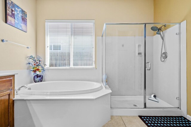 2403 W Robin Ave, Visalia, CA 93291 - bathroom with a shower stall, a bath, and tile patterned floors