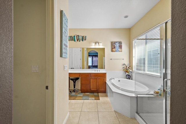 2403 W Robin Ave, Visalia, CA 93291 - full bath featuring vanity, a garden tub, tile patterned floors, and a shower stall
