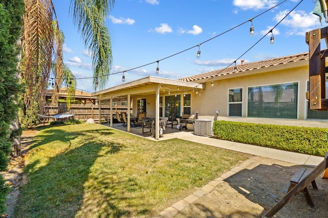 2403 W Robin Ave, Visalia, CA 93291 - back of property featuring stucco siding, a patio, a tiled roof, and an outdoor hangout area