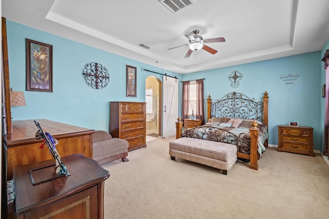 2403 W Robin Ave, Visalia, CA 93291 - bedroom with a raised ceiling, arched walkways, light colored carpet, and ensuite bath