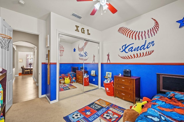 2403 W Robin Ave, Visalia, CA 93291 - carpeted bedroom with arched walkways, a closet, and ceiling fan