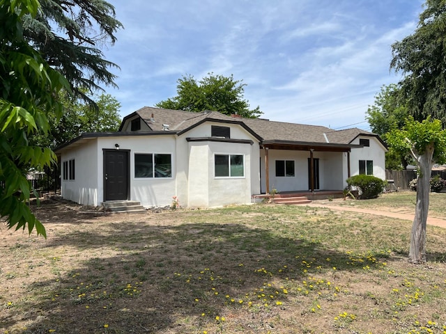 7013 N Maroa Ave, Pinedale, CA 93650 - rear view of property with stucco siding, entry steps, and a shingled roof