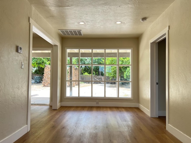 7013 N Maroa Ave, Pinedale, CA 93650 - doorway featuring a textured wall and wood finished floors