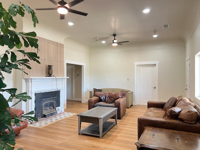 7013 N Maroa Ave, Pinedale, CA 93650 - living area with ceiling fan, ornamental molding, light wood-style flooring, a fireplace with flush hearth, and recessed lighting