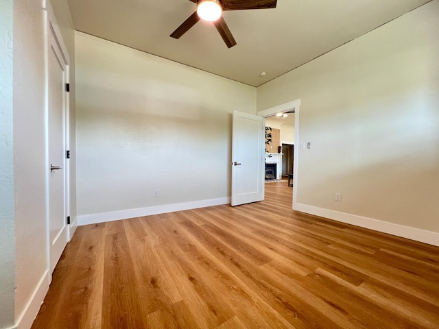7013 N Maroa Ave, Pinedale, CA 93650 - empty room with ceiling fan and light wood finished floors