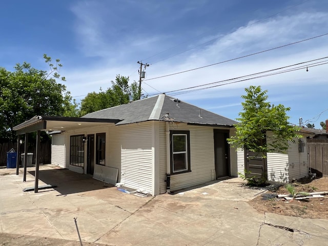 7013 N Maroa Ave, Pinedale, CA 93650 - view of front of house with a patio and roof with shingles