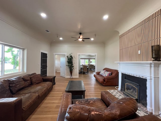 7013 N Maroa Ave, Pinedale, CA 93650 - living area with a ceiling fan, crown molding, recessed lighting, a fireplace, and light wood-type flooring