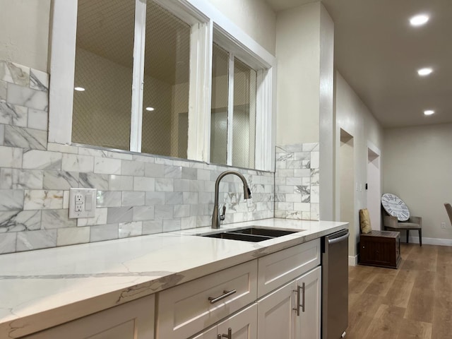 7013 N Maroa Ave, Pinedale, CA 93650 - kitchen with stainless steel dishwasher, decorative backsplash, white cabinetry, light wood-style floors, and recessed lighting