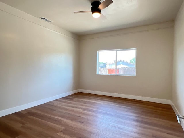 7013 N Maroa Ave, Pinedale, CA 93650 - spare room featuring wood finished floors and ceiling fan